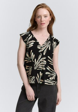 Blouse noire avec un décolleté en V et de courtes manches volantées, ornée d'un motif de feuilles crème et vertes. Tissu lisse, coupe décontractée.