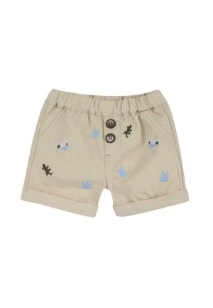 Shorts beiges avec une taille élastique, deux boutons marron et des détails brodés représentant des plantes et des lézards en bleu et vert.