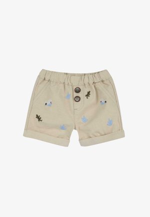 Shorts beiges avec une taille élastique, deux boutons marron et des détails brodés représentant des plantes et des lézards en bleu et vert.