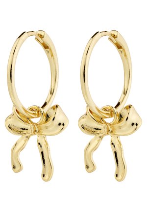 Kuldlingid, mille keskel on kaar, sile ja läikiv pind ning ümar, skulpturaalne kuju.