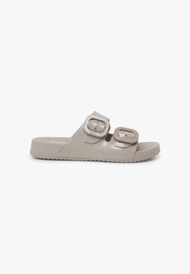 Light gray slide sandal made of smooth plastic; features two adjustable buckles, contoured footbed, and textured outsole for grip.