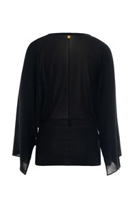 Top leggero nero con una vestibilità ampia, schiena scoperta e maniche larghe. Caratterizzato da un orlo inferiore a coste e un'etichetta piccola sul colletto.