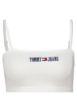 Biały bawełniany krótki top na cienkich ramiączkach, z wyszywanym granatowym logo "TOMMY JEANS" na przodzie. Gładka faktura, prosty design.