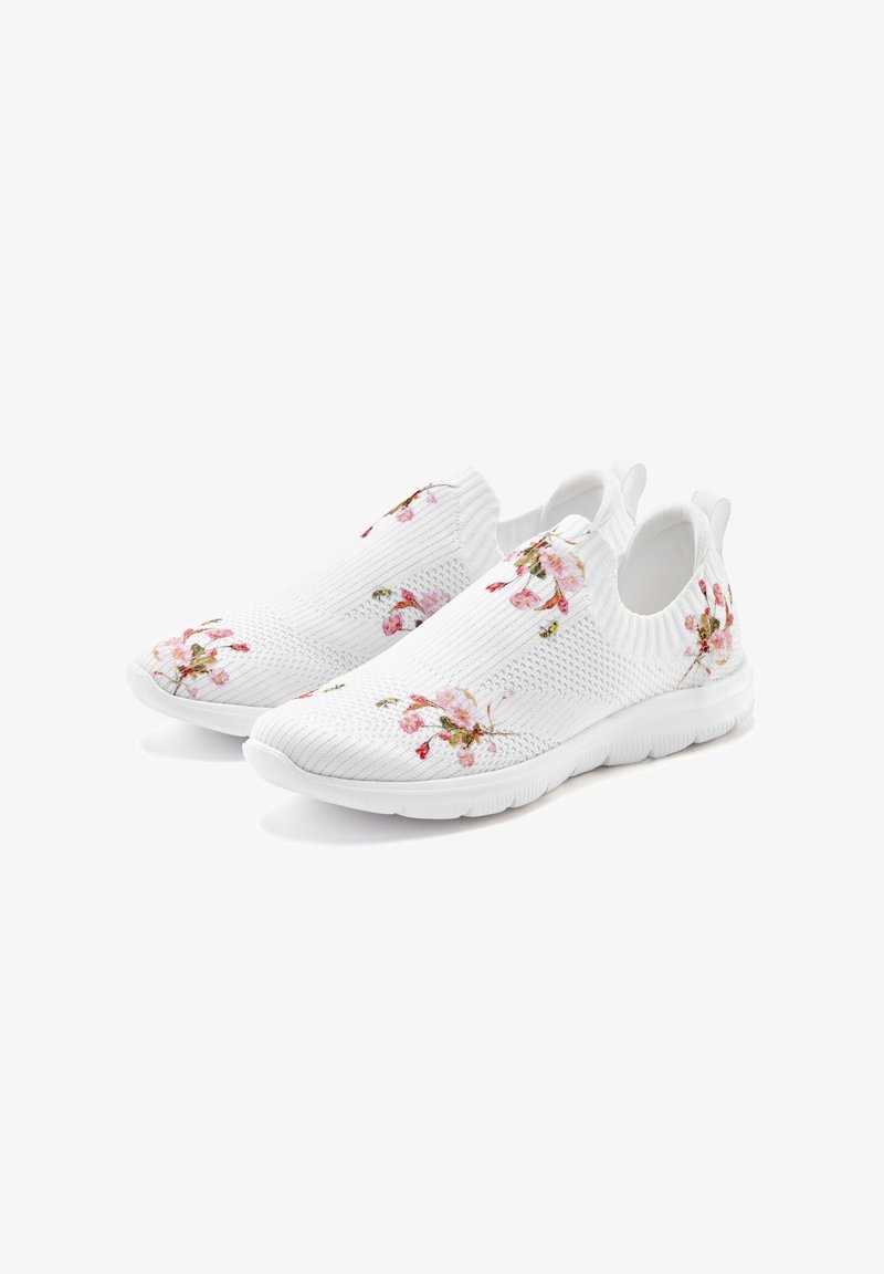 White slip-on shoes with textured knit fabric, featuring floral embroidery in pink and green, and a rubber sole for traction.