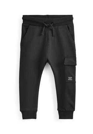 Black sweatpants made of soft fabric, featuring an elastic waistband with drawstring, side pockets, and a cargo pocket with a logo patch.