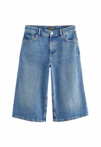 Kék farmer culottes széles lábbal, öt zsebbel és elöl gombos záródással. Halványított mosás, finom varrási részletekkel.