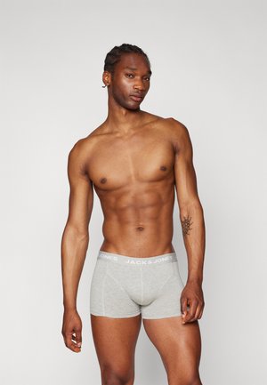 Grijze katoenen boxershorts met een strakke pasvorm en elastische tailleband met de tekst "JACK & JONES" in het wit. Gladde textuur en platte naden.