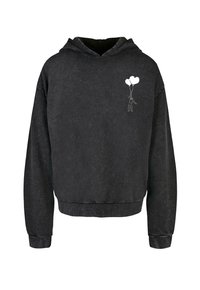 Sudadera negra con un corte relajado, puños y dobladillo de canalé. Presenta un sutil gráfico blanco de una figura sosteniendo dos globos en el lado izquierdo del pecho.