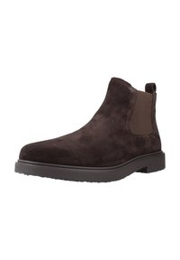 Stivale Chelsea in suede marrone scuro con pannelli elastici ai lati, linguetta alla caviglia e suola piatta in gomma.