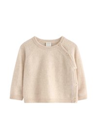 Beżowy sweter robiony na drutach z raglanowymi rękawami, okrągłym dekoltem i zapięciem na guzik z boku. Miękka tekstura i luźny krój.