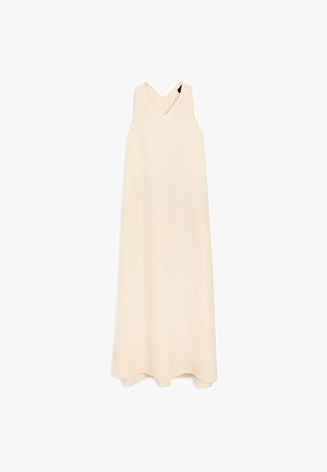 Beige maxi dress with a V-neck, sleeveless design, smooth texture, and a flowing silhouette, featuring an asymmetrical hemline.