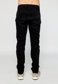 Rethink Stat Jeans a sigaretta - schwarz