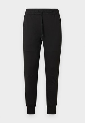 Zwarte slim-fit joggerbroek met elastische tailleband, trekkoord, met rits afsluitbare zijzakken en omgeslagen enkels.