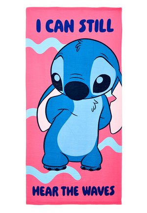 Blue cartoon alien standing shyly on a pink towel with blue waves and text "I can still hear the waves."