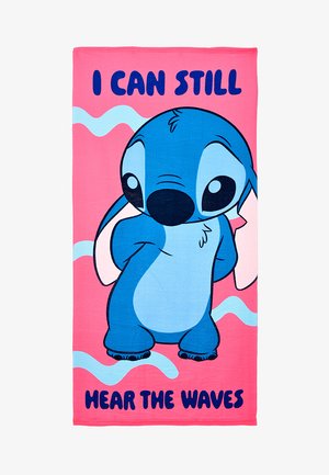 Blue cartoon alien standing shyly on a pink towel with blue waves and text "I can still hear the waves."