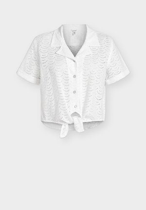 White short-sleeve button-up crop top with scalloped eyelet lace pattern and front tie detail.