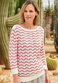 Weißer Pullover mit rotem Wellenmuster, boat neckline und Dreiviertelärmeln. Gerippte Bündchen und Saum, leichtes Strickmaterial.