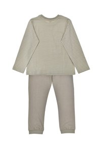 Long-sleeve top with light green and cream stripes paired with solid light beige pants. Cotton material, casual fit, elasticized cuffs.