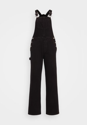 Sorte denim jumpsuit med brede ben, justerbare skulderstropper, sideknapper og frontlommer. Glatt tekstur og slitesterkt stoff.