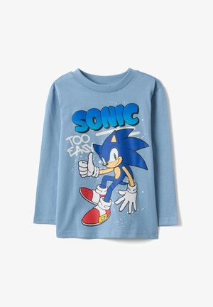 Chemise à manches longues bleu clair avec un graphisme de Sonic le Hérisson faisant un pouce levé et le texte "SONIC TOO EASY" sur le devant.