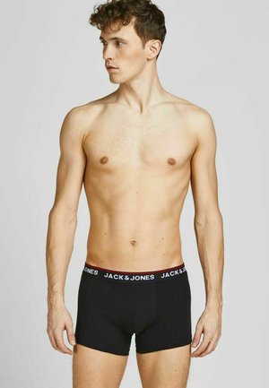 Boxer shorts in cotone nero con una fascia elastica marchiata e dettagli rossi. La vestibilità è aderente, progettata con stile per il comfort.