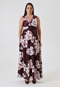 Langes, ärmelloses Kleid in Bordeauxrot mit floralem Muster. Verfügt über einen V-Ausschnitt und einen ausgestellten Rock. Das Material wirkt weich und glatt.