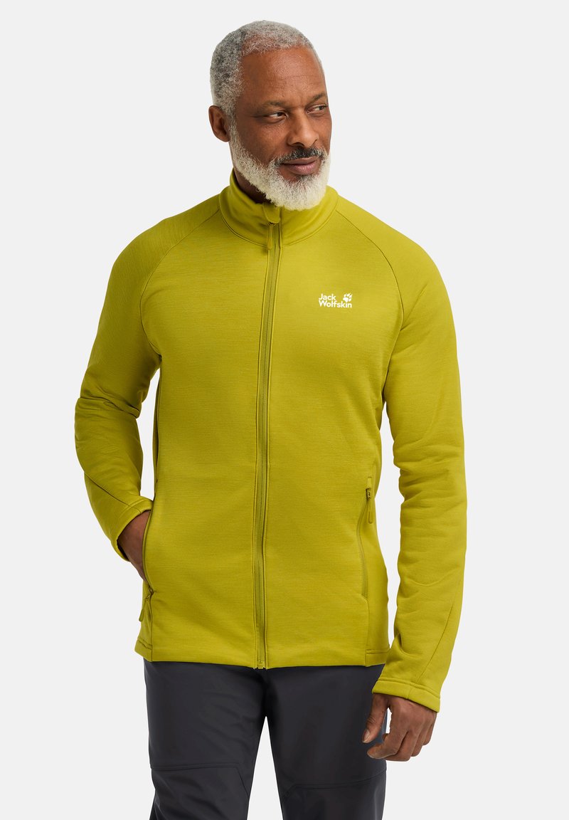 Groene fleecetrui met hoge kraag, volledige rits en zijzakken. Voorzien van een logo op de borst en textured stof.