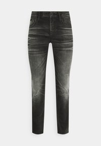 Black jeans with a faded finish, five-pocket design, zip fly, and belt loops. Made from denim with a smooth texture.