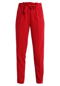 Red tailored pants made of smooth fabric, featuring a high waist, belt loops, a tied fabric belt, and two front pleats for added structure.