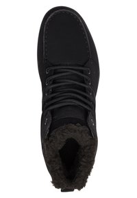 Black hiking boot with a textured upper, padded collar, and lacing system. Features a soft, grey fur lining and durable sole.