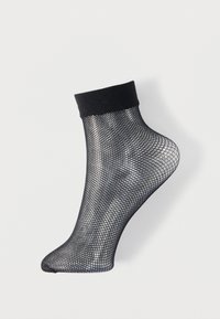 Zwarte zwartekous enkelbroek met een effen zwarte boord, met een gaasontwerp en een taps toelopende teen. Lichtgewicht en ademende textuur.