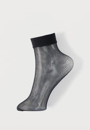 Zwarte zwartekous enkelbroek met een effen zwarte boord, met een gaasontwerp en een taps toelopende teen. Lichtgewicht en ademende textuur.