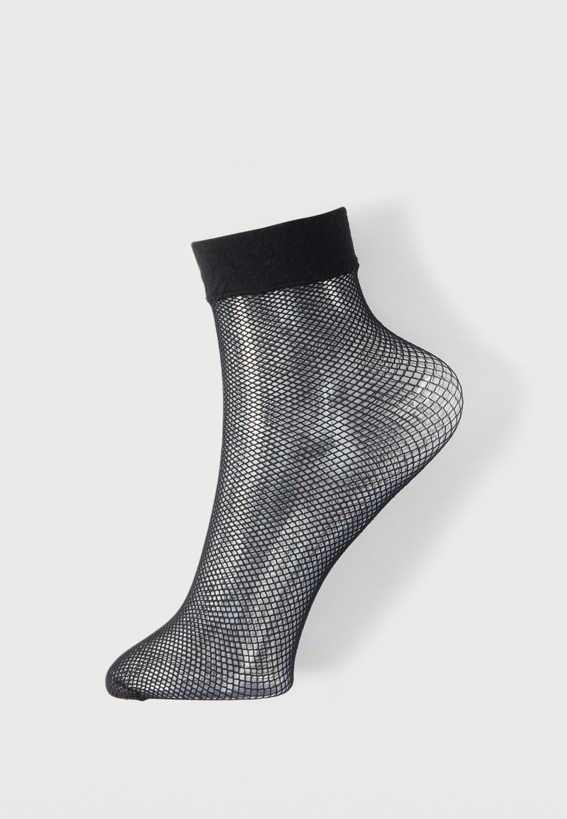 Zwarte zwartekous enkelbroek met een effen zwarte boord, met een gaasontwerp en een taps toelopende teen. Lichtgewicht en ademende textuur.