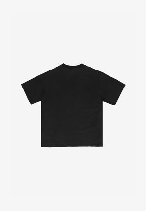 Czarna, oversize koszulka z krótkimi rękawami i okrągłym dekoltem, z gładką fakturą i surowym wykończeniem. Widok z tyłu.