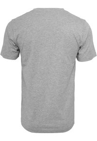 Grijze katoenen T-shirt met korte mouwen, voorzien van een ronde hals. De stof heeft een gladde textuur met een subtiel gemêleerd patroon.