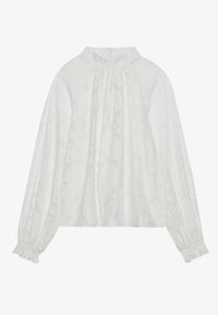 Blouse blanche à manches longues avec un col haut, un motif floral texturé, des détails froncés et des poignets élastiques.