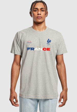 Grå bomulds T-shirt med teksten "Vive la France" i rød, hvid og blå, med et blåt hønse logo og "Équipe de France" broderi.