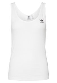 White tank top made of cotton, featuring a scoop neck, narrow straps, and a black Adidas logo on the chest. Plain texture.