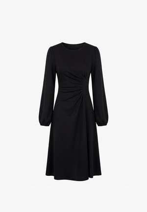 Robe midi noire à manches longues avec encolure ronde et détail froncé à la taille, avec manches bouffantes et poignets élastiques.