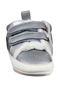 Silver toddler shoe with white fur lining, two Velcro straps, and a white sole, shown from the front.