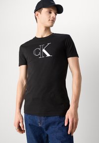 Calvin Klein Jeans OUTLINE MONOLOGO TEE - T-shirts print - black