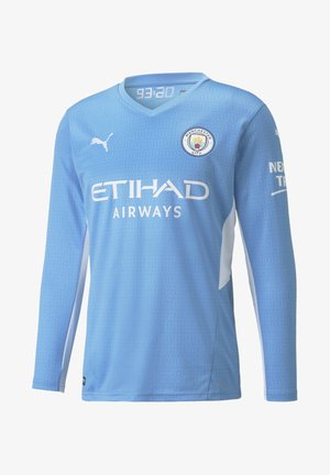 Light blue long-sleeve soccer jersey with textured design, white accents, embroidered team logo, and sponsor text. Made of synthetic material.