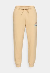 SWEATPANTS HERITAGE - Tracksuit bottoms - irish cream