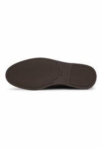 Brown rubber shoe sole with a textured surface and a flat edge. Features embossed logo and a rounded shape with a clean design.