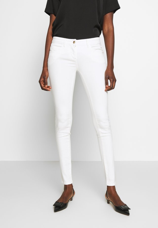 PANTALONI - Jeansy Skinny Fit - bianco