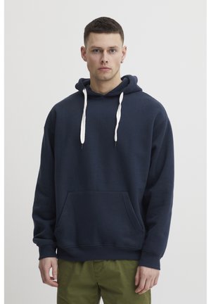 Navy blue hoodie made from soft fabric. Features a kangaroo pocket, drawstring hood with contrasting white ties, and ribbed cuffs.