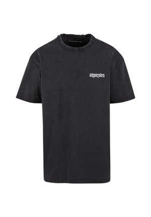 Tricou din bumbac negru cu mâneci scurte, guler rotund și un logo alb pe partea stângă a pieptului. Croială clasică, cu o textură netedă și fără modele.