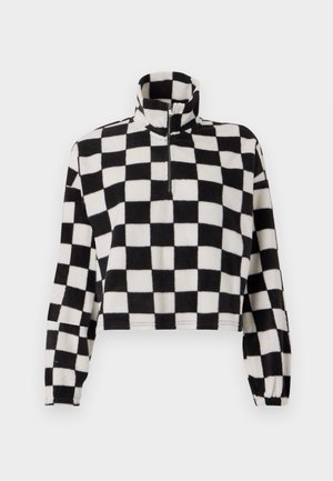 Fleece cropped pullover with high collar, featuring a black and white checkerboard pattern, half-zip front, and elasticized sleeve cuffs.