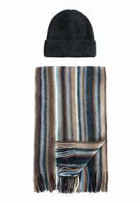 Knitted dark blue beanie and striped scarf with brown, blue, and gray tones. Scarf has fringed edges and alternating color patterns.