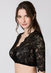 Schwarzes Spitzen-Bralette mit kurzen Ärmeln, gewelltem Rand und floralem Muster. Der Stoff ist durchsichtig, mit einer glatten, dehnbaren Unterlage.
